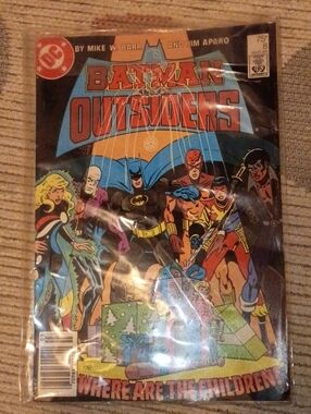 DC Batman Outsiders Comic Cover in Black, Red, Blue, Yellow
